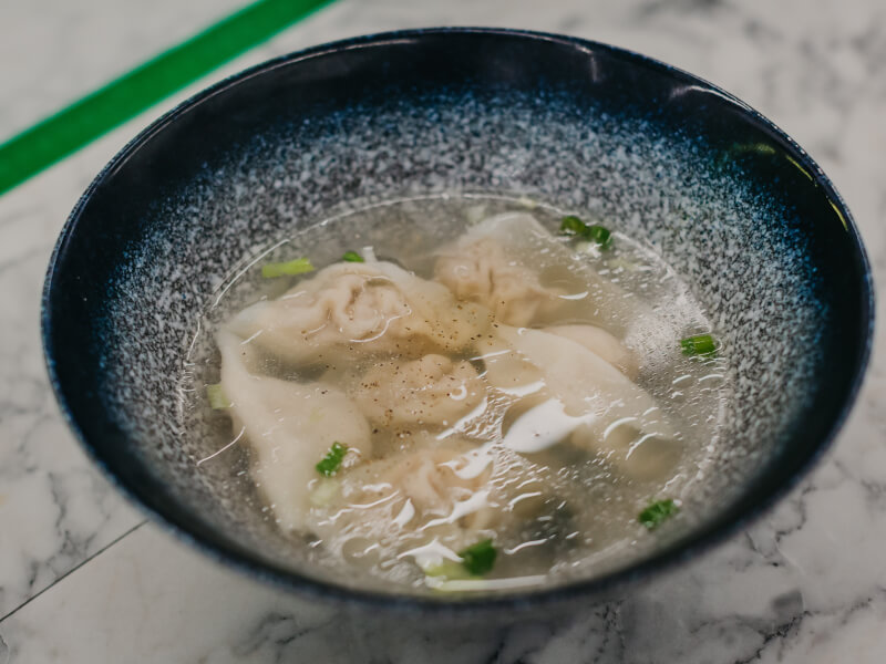 A bowl of steaming noodle soup